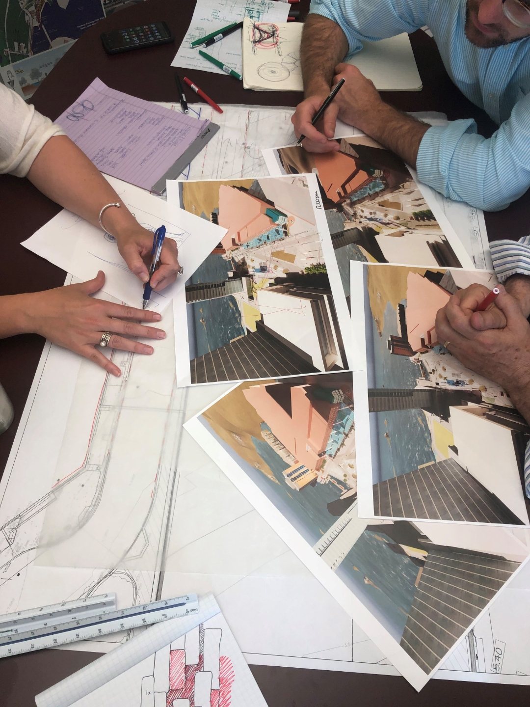 Designers sketching an early concept plan by hand